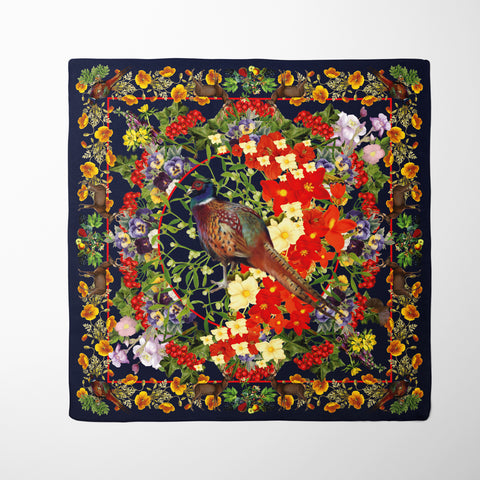 Exquisite Pheasant Organic Silk Scarf. Rich brown tones and vibrant floral bursts create a captivating design. Crafted from 100% silk twill with meticulous hand-stitched detailing. Presented in a Silktopia box, a perfect gift. Shop now and make a refined statement.